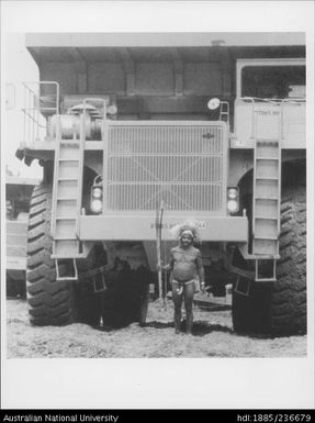 Indigenous person and Mining Truck at OK Tedi Mining, Papua New Guinea