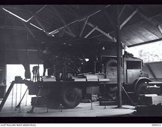 RABAUL, NEW BRITAIN, 1946-03-27. THE MOBILE PRINTING PRESS USED IN THE PRODUCTION OF THE ARMY NEWSPAPER GUINEA GOLD, WHICH IS MOUNTED ON A TRUCK. THE NEWSPAPER CHANGED ITS LOCATION FROM LAE TO 8 ..