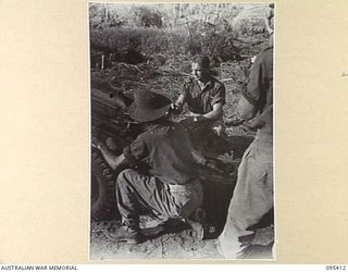 KIARIVU EMERGENCY LANDING GROUND, NEW GUINEA, 1945-08-13. FLYING OFFICER W.H.R. SMITH, 12 LOCAL AIR SUPPLY UNIT ROYAL AUSTRALIAN AIR FORCE, PILOT OF THE FIRST PLANE TO LAND ON THE AIRSTRIP SINCE ..