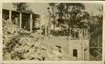 Building frame and brickwork with workmen on site, Brisbane, 1936