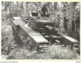 MADANG, NEW GUINEA. 1944-10-12. A CHURCHILL V SUCCESSFULLY NEGOTIATING A TANK CROSSING DURING TESTS CONDUCTED AT HQ 4 ARMOURED BRIGADE