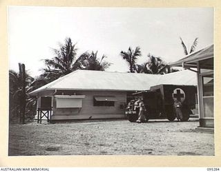 PALMALMAL PLANTATION, JACQUINOT BAY, NEW BRITAIN, 1945-08-14. AN AMBULANCE OUTSIDE THE OPERATING THEATRE OF 2/8TH GENERAL HOSPITAL