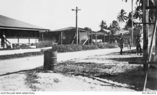 SALAMAUA, NEW GUINEA, 1940-06?. INTERNMENT CAMP. GERMAN INTERNEES WERE HOUSED IN THE BUILDING ON THE LEFT, ITALIANS IN THE CENTRE BUILDING (OPPOSITE THE GUARD TENT). THE GUARD WAS PROVIDED BY THE ..