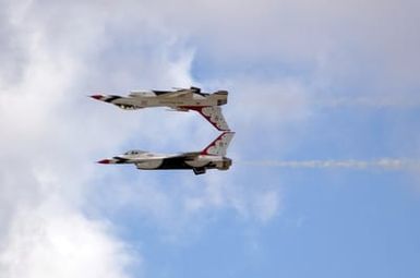 A U.S. Air Force Thunderbirds Aerial Demonstration Team F-16C Fighting Falcon aircraft performs an inverted flight maneuver during a performance for the Open House Air Show, Sept. 12, 2004, at Andersen Air Force Base, Guam. (U.S. Air Force PHOTO by AIRMAN 1ST Class Kristin Ruleau). (Released)