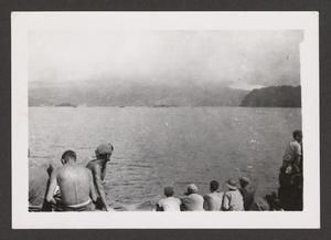 [Servicemen Sitting Near Water]
