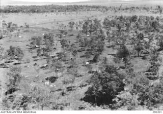 GOODENOUGH ISLAND, NEW GUINEA. 1942-10. TENTS EMPTY OF MEN AND DELIBERATELY SET OUT WERE PART OF THE BLUFF AND DECEPTION PRACTICED BY A SMALL FORCE OF AUSTRALIANS WHO SEIZED THE ISLAND AND LED THE ..