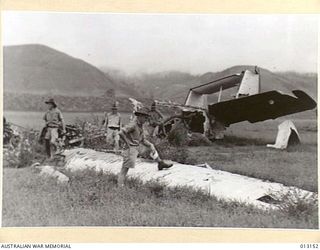 1942-08-28. NEW GUINEA. BULOLO. A WRECKED JUNKERS AT BULOLO 'DROME (NEGATIVE BY D. PARER)