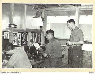 TOROKINA, BOUGAINVILLE ISLAND. 1945-01-18. A SECTION OF THE CIPHER OFFICE OF "B" CORPS OF SIGNALS. NX83042 WARRANT OFFICER II, H. COHEN (2) CAN BE SEEN OPERATING A TYPE X MACHINE. IDENTIFIED ..