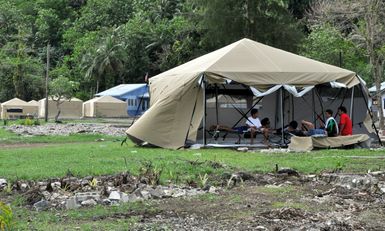Earthquake ^ Flooding ^ Tsunami - Amanave, American Samoa, November 15, 2009 -- Large, strong new tents were well received in Amanave, which was the first location to receive the 16-by-16 foot tents designed to withstand the windy, rainy seasonal conditions now prevailing in American Samoa. They replaced smaller, dome style tents. Recipients praised the flexibility of the new tents. The walls can be raised or lowered as needed. The can be closed for privacy. Inside, they remained dry during torrential rain that began several hours after the tents were erected. Richard O'Reilly/FEMA.