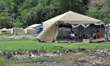 Earthquake ^ Flooding ^ Tsunami - Amanave, American Samoa, November 15, 2009 -- Large, strong new tents were well received in Amanave, which was the first location to receive the 16-by-16 foot tents designed to withstand the windy, rainy seasonal conditions now prevailing in American Samoa. They replaced smaller, dome style tents. Recipients praised the flexibility of the new tents. The walls can be raised or lowered as needed. The can be closed for privacy. Inside, they remained dry during torrential rain that began several hours after the tents were erected. Richard O'Reilly/FEMA.