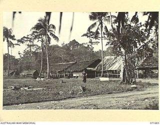 LAE, NEW GUINEA. 1944-03-25. THE OTHER RANKS' MESS, THE NON COMMISSIONED OFFICERS' MESS, THE TENT LINES AND LIVING QUARTERS AT HEADQUARTERS LAE BASE SUB-AREA. CORPORAL WALSH WALKS TOWARDS THE ..