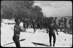 Group of natives by the shore