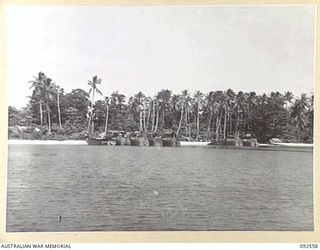 BOUGAINVILLE. 1945-05-25. TROOPS OF 31/51 INFANTRY BATTALION BEING TRANSFERRED FROM SMALL CRAFT TO BARGES OF 42 LANDING CRAFT COMPANY ON THE NORTH BOUGAINVILLE COAST