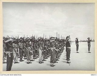 WEWAK, NEW GUINEA. 1945-10-26. A CEREMONIAL PARADE AND MARCH PAST BY 6 DIVISION WAS INSPECTED BY GENERAL SIR THOMAS A. BLAMEY, COMMANDER-IN-CHIEF, ALLIED LAND FORCES, SOUTH WEST PACIFIC AREA, AT ..