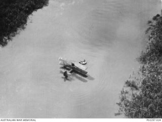 Kerawari River, Wewak area, New Guinea, 1945-06. Aerial view of a Supermarine Walrus amphibian aircraft of No. 111 Air Sea Rescue Flight RAAF at rest on the Kerawari River, during the rescue of the ..