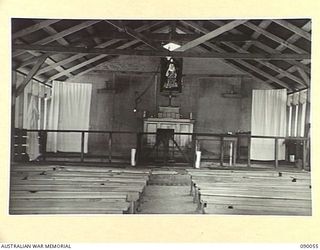 TOROKINA, BOUGAINVILLE. 1945-03-27. THE INTERIOR OF THE CHAPEL OF ST BERNADETTE AT HEADQUARTERS ROYAL NEW ZEALAND AIR FORCE. THE STAINED WINDOW WAS WORKED ON PLASTIC GLASS BY A SERVICEMAN