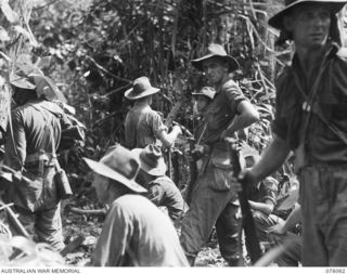 DANMAP RIVER AREA, NEW GUINEA. 1945-01-02. TROOPS OF THE 2/11TH INFANTRY BATTALION WAITING TO LAUNCH THEIR ATTACK ON JAPANESE POSITIONS ON A HILL FEATURE BEYOND MATAPAU. IDENTIFIED PERSONNEL ARE:- ..