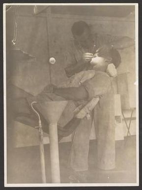 [Dental Officer and Patient]