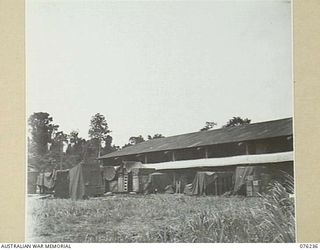 LAE, NEW GUINEA. 1944-09-27. STORES UNDER THE PROTECTION OF TARPAULINS AT THE 43RD FIELD ORDNANCE DEPOT