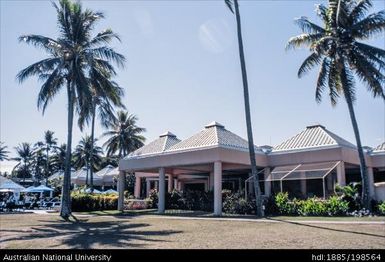 Fiji - resort complex, white buildings, blue cafe umbrellas
