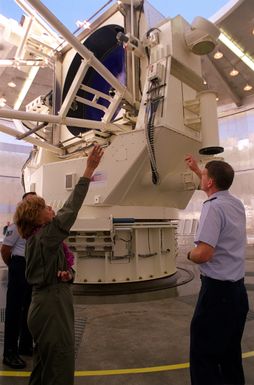 Secretary of the Air Force, Sheila Widnall, and MAJ Joseph Bishop, AFSPC, discuss the Advanced Electro-Optical System (AEOS) located at Phillips Laboratory. It is the Department of Defense's largest optical telescope supporting the Air Force Space Command space surveillance mission