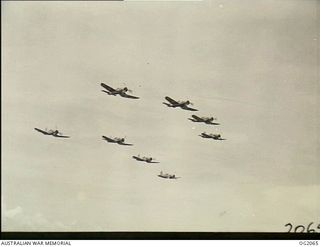 AIRBORNE OVER BOUGAINVILLE ISLAND, SOLOMON ISLANDS. 1945-01-17. PHOTOGRAPH TAKEN FROM A WIRRAWAY AIRCRAFT OF NO. 5 (ARMY CO-OPERATION) SQUADRON RAAF WHICH ALSO ACT AS PATHFINDERS TO ROYAL NEW ..