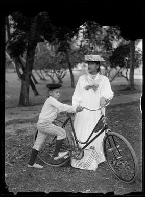 Woman and boy with bicycle