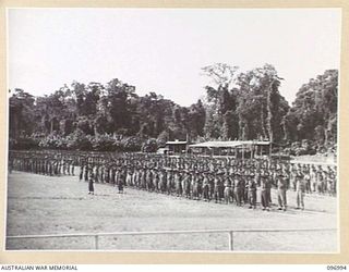 TOROKINA, BOUGAINVILLE. 1945-09-24. A GENERAL VIEW OF TROOPS OF 15 INFANTRY BRIGADE ON PARADE AT GLOUCESTER PARK AT A PRESENTATION OF AWARDS AND MARCH PAST CEREMONY ATTENDED BY MAJOR GENERAL W. ..