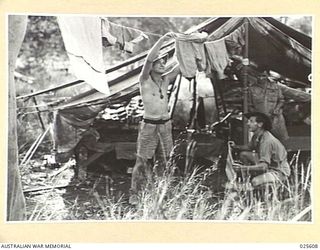 PORT MORESBY, PAPUA. 1942-07. AUSTRALIAN TROOPS IN NEW GUINEA HAVE A WASHING DAY