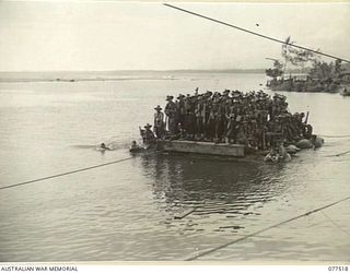 BOUGAINVILLE ISLAND. 1944-12-06. TROOPS OF THE 15TH INFANTRY BATTALION ABOARD A FERRY DRIVEN BY TWO JEEPS, WHICH CROSSES THE TARGESSI RIVER DURING THEIR ADVANCE TO TAKE OVER THE POSITIONS OCCUPIED ..