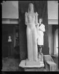 Artist Ada May Sharlpess next to the model for her sculpture "Nuestra Reina de Los Angeles" now in Echo Park, Los Angeles, 1935