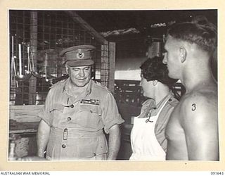 LAE, NEW GUINEA. 1945-05-11. GENERAL SIR THOMAS A. BLAMEY, COMMANDER-IN-CHIEF, ALLIED LAND FORCES, SOUTH WEST PACIFIC AREA (1), SPEAKING WITH AUSTRALIAN WOMEN'S ARMY SERVICE COOK, PRIVATE I. ..
