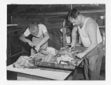 [Two Men Cutting Turkeys]