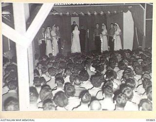 LAE AREA, NEW GUINEA, 1945-07-09. A SCENE FROM "A MARRIAGE HAS BEEN ARRANGED" DURING THE REVUE "OVER TO YOU" STAGED BY 19 LINES OF COMMUNICATION AREA SIGNALS IN THE UNIT'S RECREATION HUT WHICH WAS ..