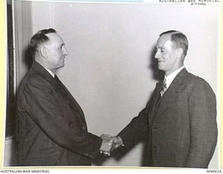 MELBOURNE, VIC. LEFT TO RIGHT: HON. T.J. COLLINS MHR, MINISTER IN CHARGE OF EXTERNAL TERRITORIES AND ASSISTANT MINISTER FOR INTERIOR, WITH HON. HUBERT L. MURRAY, ADMINISTRATOR FOR PAPUA, BEFORE A ..