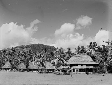 [Pacific Island view with many fale and Palm trees]