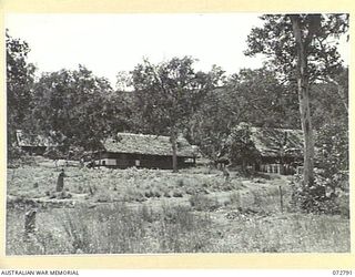 PORT MORESBY, NEW GUINEA. 1944-05-01. A SECTION OF THE ADMINISTRATION AREA OF HEADQUARTERS NEW GUINEA FORCE SHOWING, FRONT TO REAR:- THE INTELLIGENCE IA HUT; THE INTELLIGENCE IX HUT; AND THE ROYAL ..