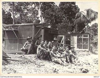 Eleven members of 9 Pigeon Section at their lofts at Malmal mission. Operating under the command of Lieutenant (Lt) K V Benwell, (1), 15 men and 150 birds are now being trained for future ..