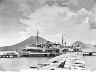 TOBOI WHARF, RABAUL, NEW BRITAIN. 1945-10-05. THE PAPUAN GOVERNMENT OFFICIAL VESSEL LAURABADA BERTHED ALONGSIDE THE WRECKED TOBOI WHARF. THIS SHIP WAS TRANSFERRED FROM CIVIL CONTROL TO THE ROYAL ..