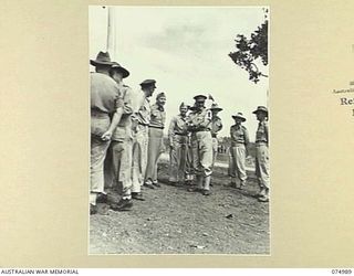 PORT MORESBY, PAPUA. 1944-08-05. MAJOR GENERAL B.M. MORRIS, DSO, GENERAL OFFICER COMMANDING, AUSTRALIAN NEW GUINEA ADMINISTRATIVE UNIT (1) CHATTING WITH MEMBERS OF THE OFFICIAL PARTY AT THE ..