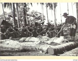 SIAR, NEW GUINEA. 1944-06-25. OFFICERS AND NON COMMISSIONED OFFICERS OF C COMPANY, 57/60TH INFANTRY BATTALION RECEIVING INSTRUCTION IN BATTLE TACTICS ON THE UNIT SAND TABLE. IDENTIFIED PERSONNEL ..