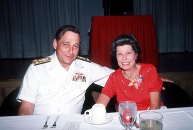 Vice Admiral Thomas R. Kinnebrew, deputy and chief of staff, Pacific Fleet, and his wife attend a Military Spouse Day luncheon at the officers club