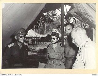 RABAUL, NEW BRITAIN. 1945-10-27. GENERAL SIR THOMAS A. BLAMEY, COMMANDER-IN-CHIEF, ALLIED LAND FORCES, SOUTH WEST PACIFIC AREA (4) TALKING TO MATRON E.M. GREEN (2), LIEUTENANT COLONEL LOEWENTHAL ..