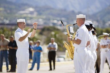 The US Navy (USN) Pacific Fleet Band performs during a Welcoming Ceremony for the USN Military Sealift Command (MSC), Hospital Ship, USNS MERCY (T-AH 19), as it arrives during a port visit at Navy Base Pearl Harbor, Hawaii (HI). The USNS MERCY is starting a scheduled five-month deployment to deliver aid and humanitarian assistance to the Pacific Islands, and Southeast Asia