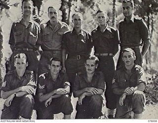MALMAL VILLAGE, NEW BRITAIN. 1944-12-24. PERSONNEL OF THE "Z" FIELD SECURITY SECTION ATTACHED TO THE 5TH DIVISION. FRONT ROW, LEFT TO RIGHT: SERGEANT K. G. MCRAE; NX48809 CORPORAL K. J. FARMER; ..