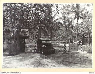 RABAUL, NEW BRITAIN. 1945-10-25. A MEMBER OF 11 DIVISION PROVOST COMPANY AT NUMBER 2 PROVOST POST ON THE MALAGUNA ROAD BLOCK