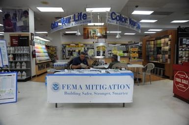 Disaster Survivor Assistance specialist Coy Carl works at hazard mitigation educational outreach at Ace Hardware in Saipan, after the island was devastated by Typhoon Soudelor in August.