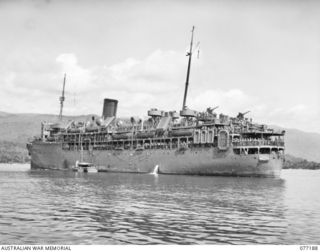 SWAN BEACH, JACQUINOT BAY, NEW BRITAIN. 1944-11-26. THE AMERICAN TROOPSHIP, "EVANGELINE" ARRIVING OFF SWAN BEACH (BARGE POINT NO. 22) WITH TROOPS OF THE 16TH INFANTRY BATTALION ABOARD