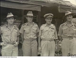 TOROKINA, BOUGAINVILLE ISLAND, SOLOMON ISLANDS. 1945-01-19. GROUP PORTRAIT OF RAAF SENIOR OFFICERS AFTER A CONFERENCE AT TOROKINA. LEFT TO RIGHT: 260446 WING COMMANDER G. H. PURVIS, MELBOURNE, VIC; ..