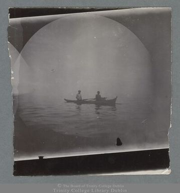 Photograph of a boat with two rowers in Apia, Samoa